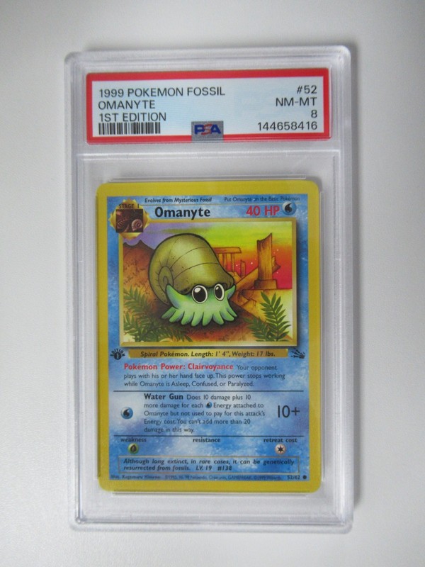 1999 Pokemon Fossil 1st Edition Omanyte #52/62 PSA 8