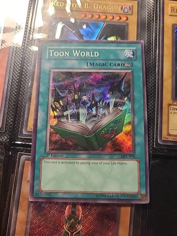 Yu-Gi-Oh! TCG – Toon World MRL-076 – 1st Edition Super Rare – Holo Magic Type