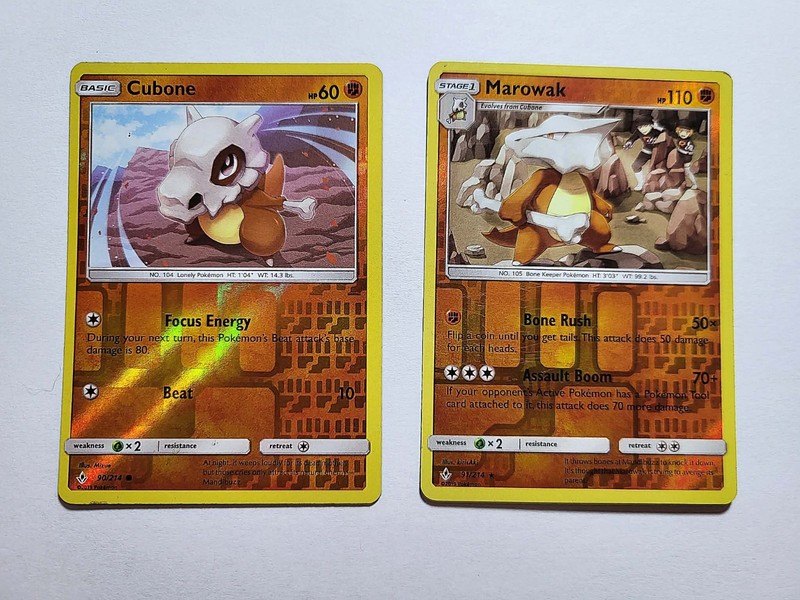 2 unbroken bonds cards (rev holos Cubone 90/214 & Marowak 91/214) HEAVY PLAY!